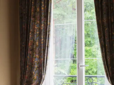 Flowing voile sheer curtains adding a touch of sophistication to a dining room